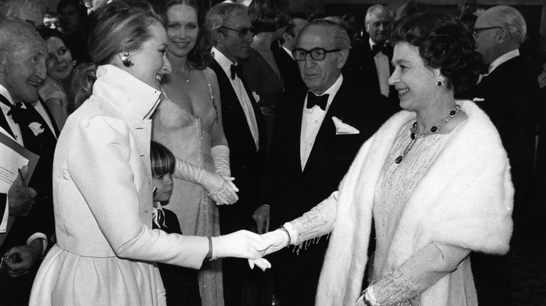 Meryl Streep meeting Queen Elizabeth II after a Royal Film Performance of 'Kramer vs Kramer' at the Odeon, Leicester Square, London.