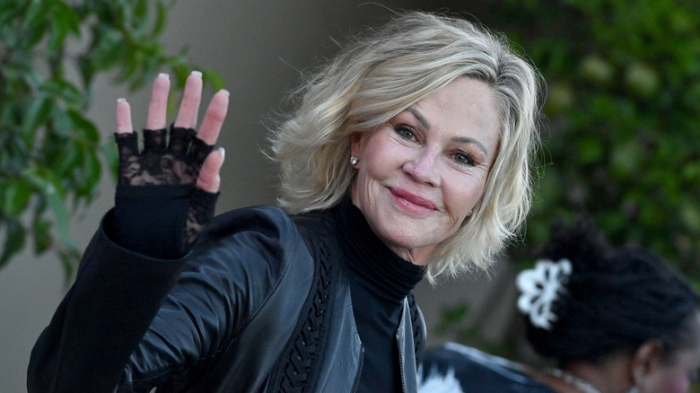 Melanie Griffith with short blonde hair waving at the 2024 Goldie Hawn Foundation event