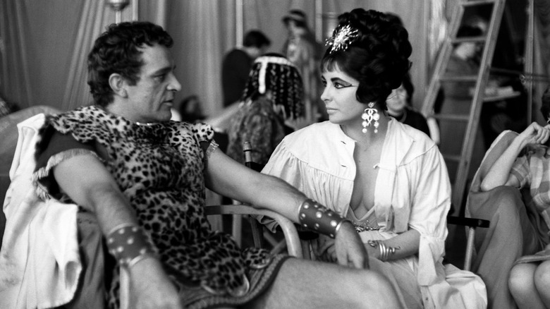 Black and white photo of Richard Burton and Elizabeth Taylor on the set of "Cleopatra"