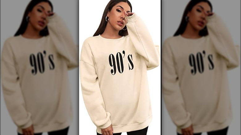Model wearing off-white 90s printed sweatshirt
