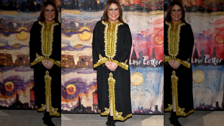 Rachael Ray wearing an outdated black and gold muumuu and ankle boots