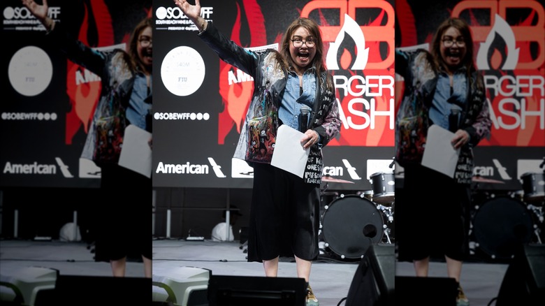 Rachael Ray wearing an outdated graffiti print jacket and midcalf skirt