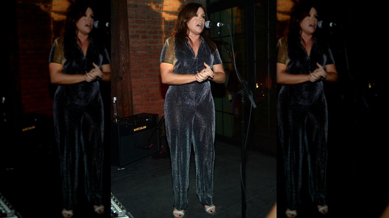 Rachael Ray wearing an outdated velvet jumpsuit and heels