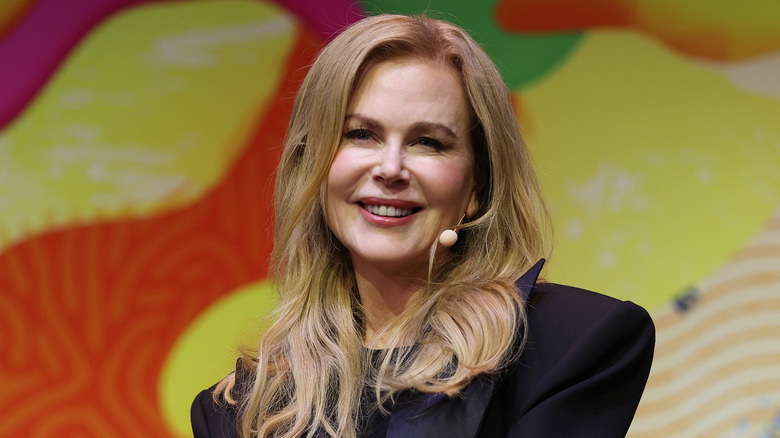 Nicole Kidman talking into a headset microphone