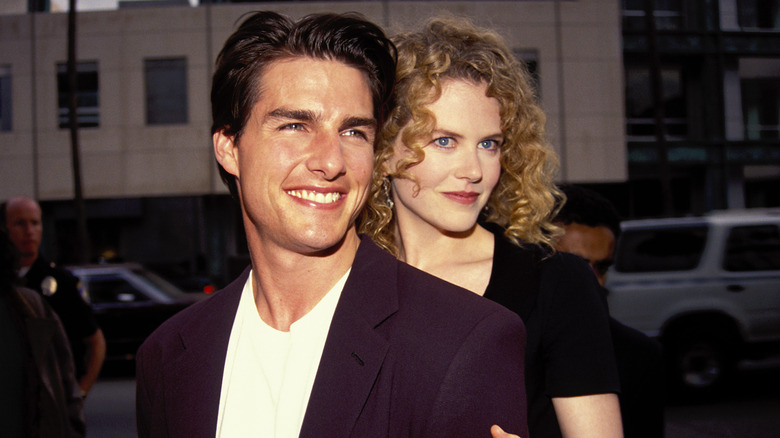 Nicole Kidman holding Tom Cruise from behind