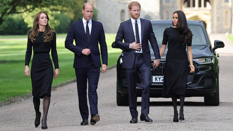 Kate Middlton, Prince William, Prince Harry, and Meghan Markle walking