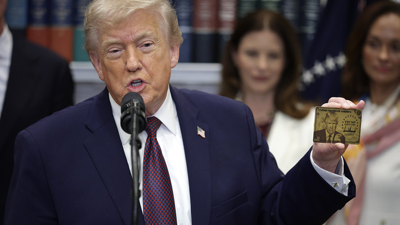 Donald Trump presenting the Trump Gold Card