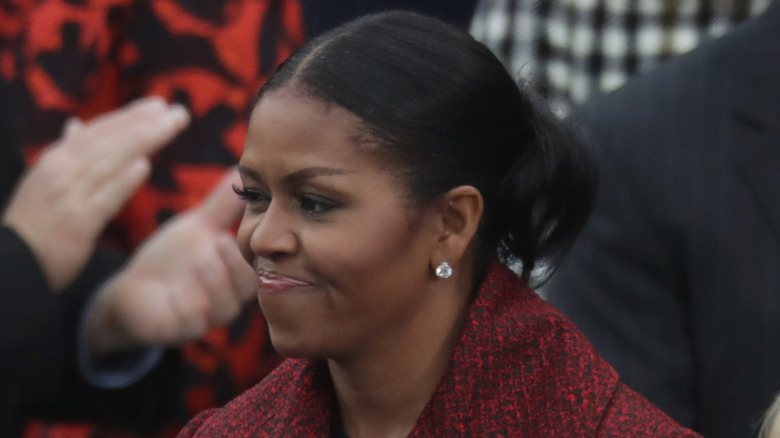 Michelle Obama smiling grimly at Trump's first inauguration