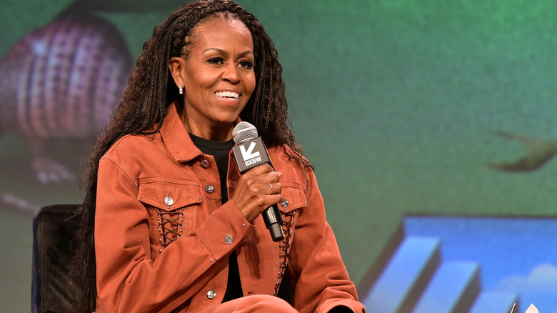 Michelle Obama speaking on a podcast