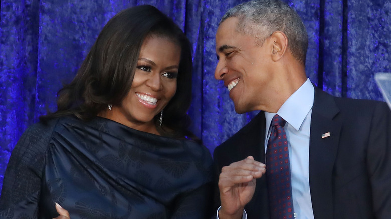 Michelle Obama and Barack Obama smiling together