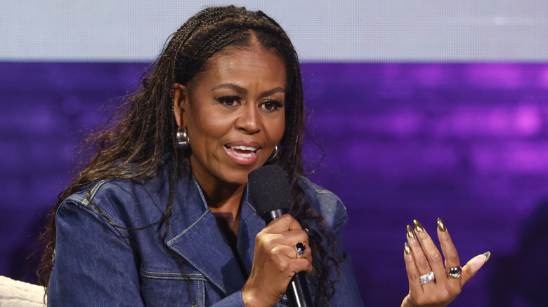 Michelle Obama speaking into a microphone