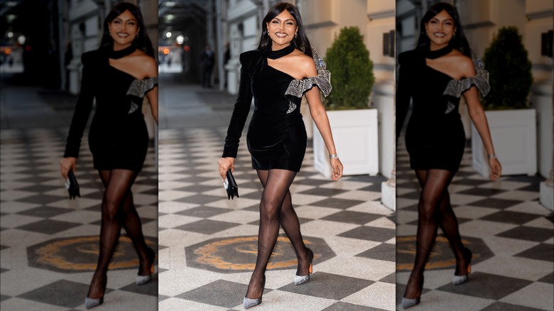 Mindy Kaling smiling and walking
