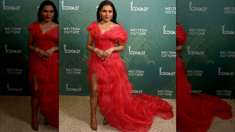 Mindy Kaling wearing a red flowing gown