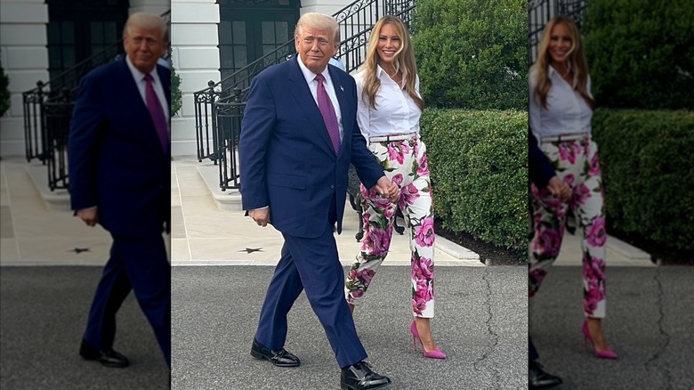 Melania Trump in rose pattern pants walking alongside Donald Trump in a suit