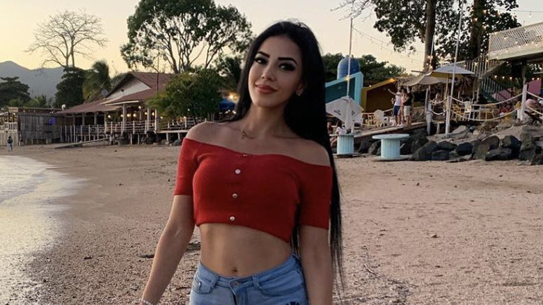 Jasmine Pineda smiling on a beach in 2022.