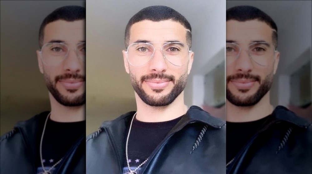 Aladin Jallali in big silver glasses