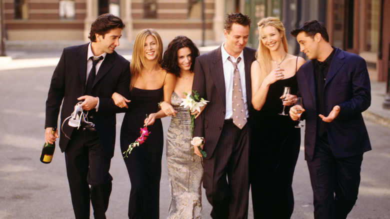 A still of the main cast of "Friends" walking together.