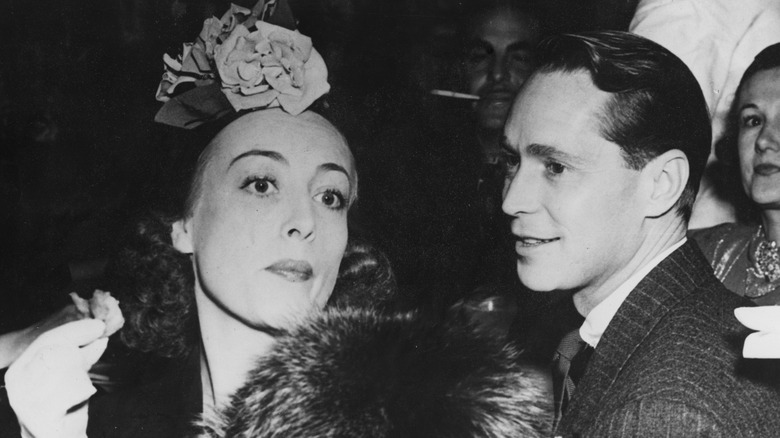 Joan Crawford and Franchot Tone attend a party in 1936