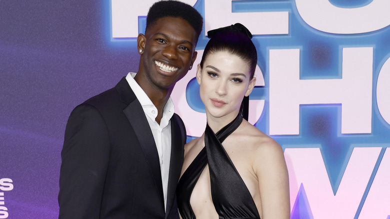 Phoebe poses on the red carpet with Robert Ross