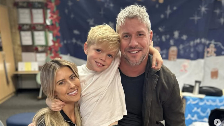 Ant Anstead and ex-wife Christina Haack standing with their son Hudson