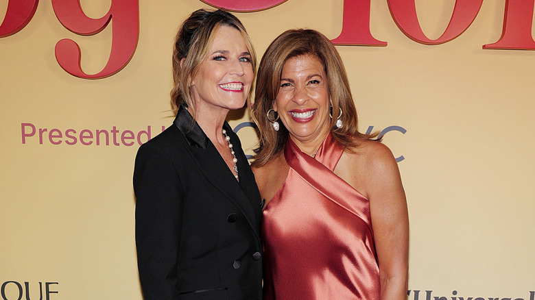 Savannah Guthrie and Hoda Kotb posing for a photo in 2025