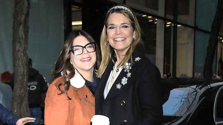 Savannah Guthrie and Annie Guthrie smiling outdoors in front of a vehicle