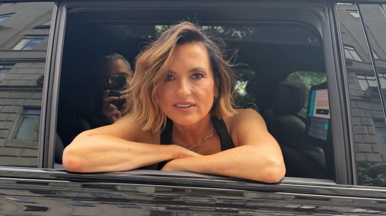 Mariska Hargitay leaning out of a car, showing off her golden bob haircut for Taylor Swift's wedding.