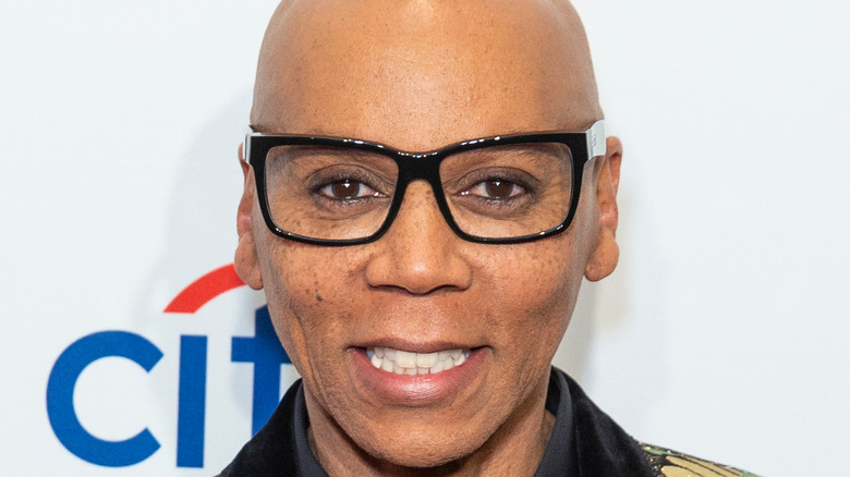 RuPaul Charles smiling on the red carpet