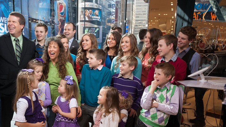 The Duggar family smiling 