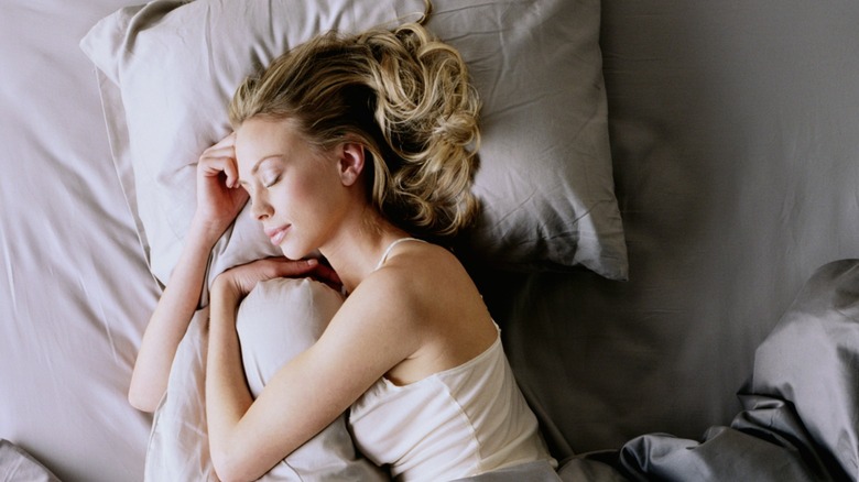 Woman sleeping in bed