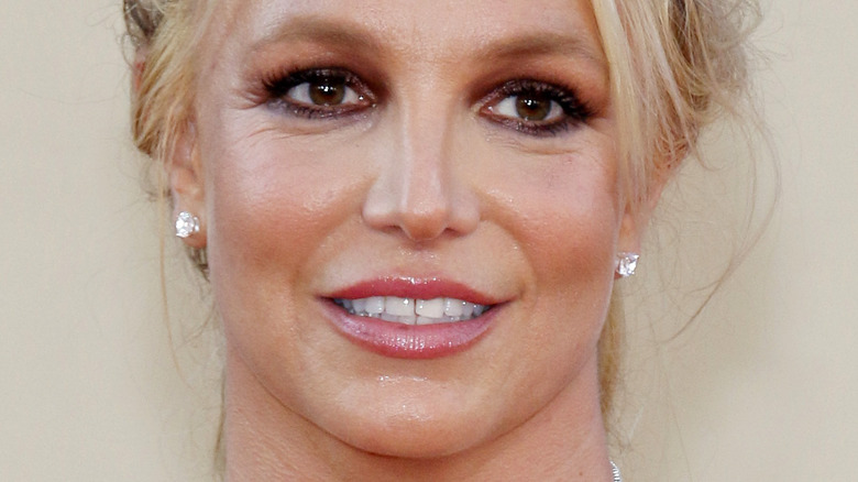 Britney Spears smiling and looking to the side