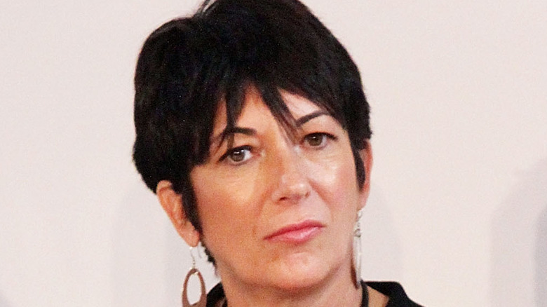 Ghislaine Maxwell sits onstage at an event