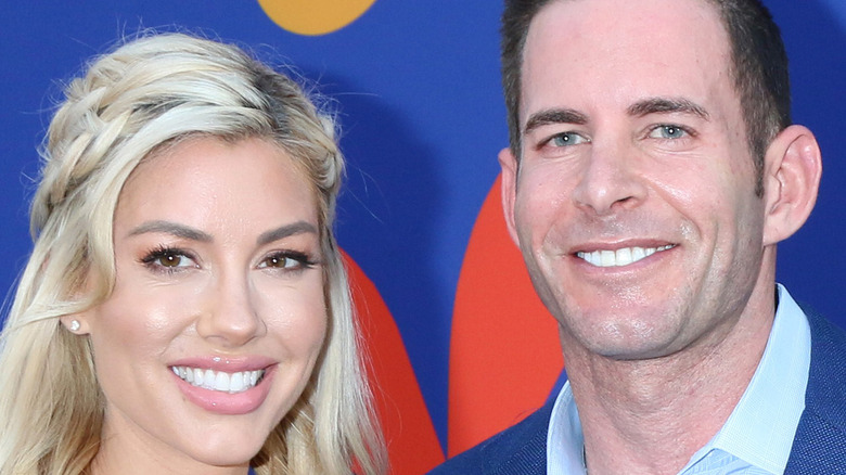 Heather Rae and Tarek El Moussa pose at event