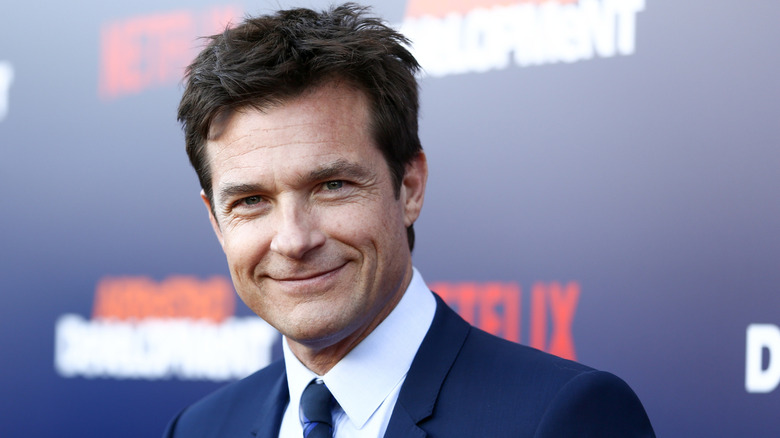 Jason Bateman smiling and posing.