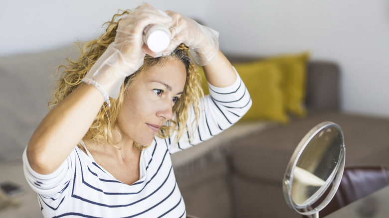 Woman dyeing her hair