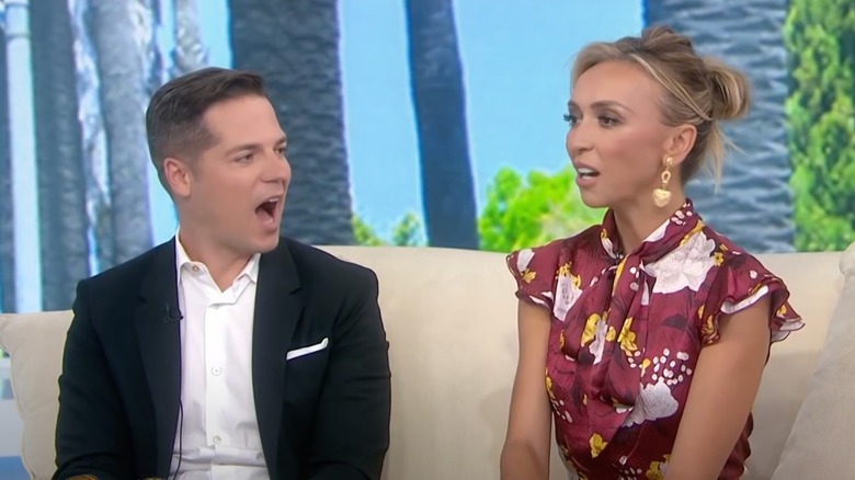 Jason Kennedy and Giuliana Rancic talking