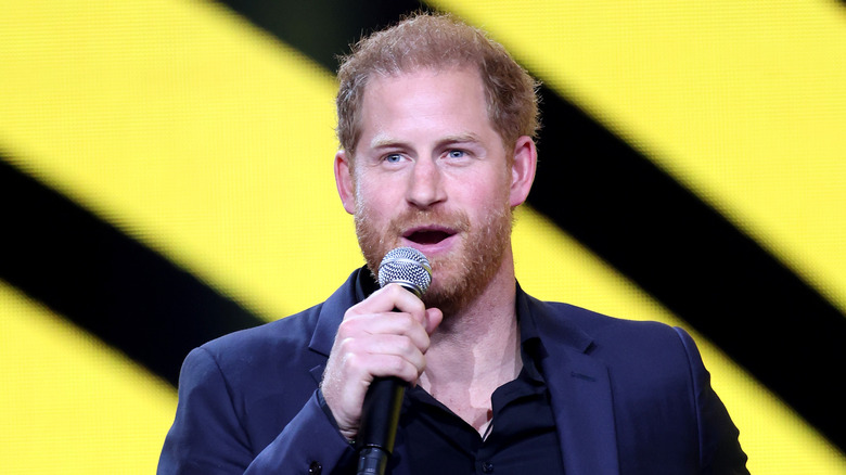 Prince Harry talking with a microphone