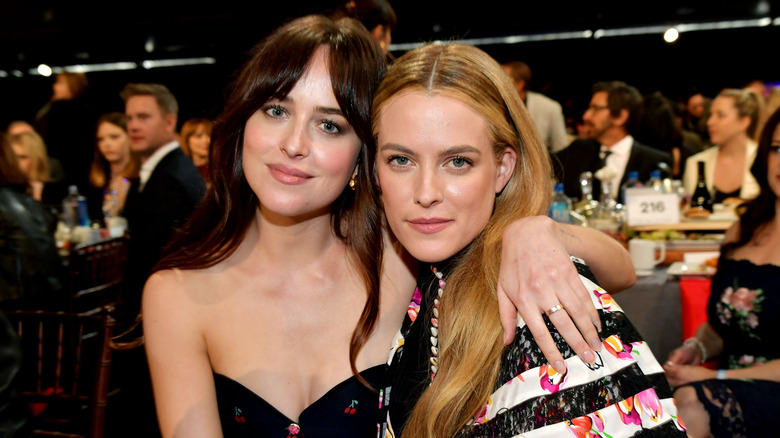 Dakota Johnson and Riley Keough pose during the 2019 Film Independent Spirit Awards