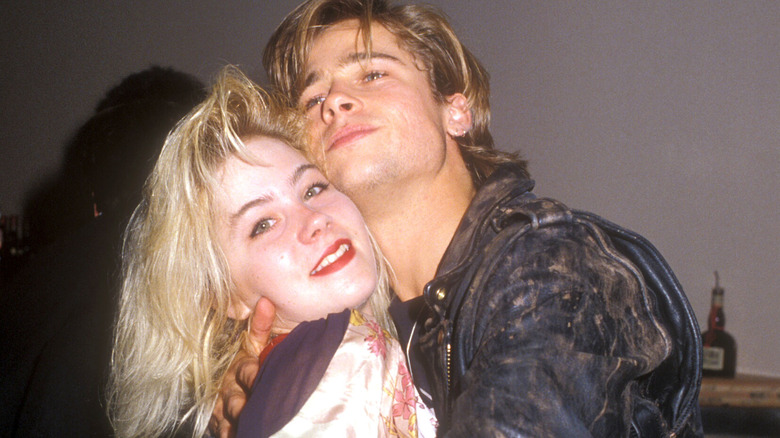 Christina Applegate and Brad Pitt smiling