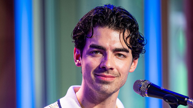 Joe Jonas speaking at event