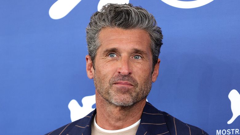 Patrick Dempsey posing for Ferrari red carpet event