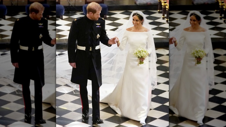 Meghan Markle and Prince Harry holding hands at their wedding