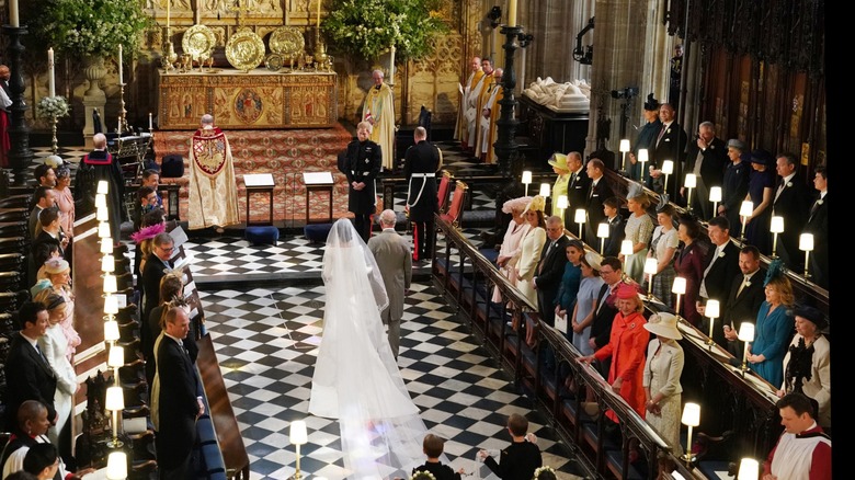 King Charles III walking Meghan Markle down the aisle