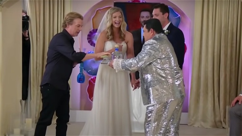 David Spade and Guillermo Rodriguez handing shots to wedding couple