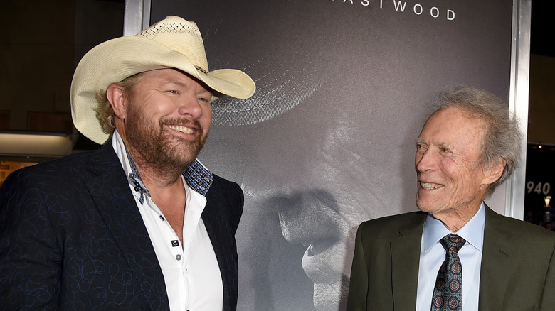 Toby Keith and Clint Eastwood smiling during a conversation