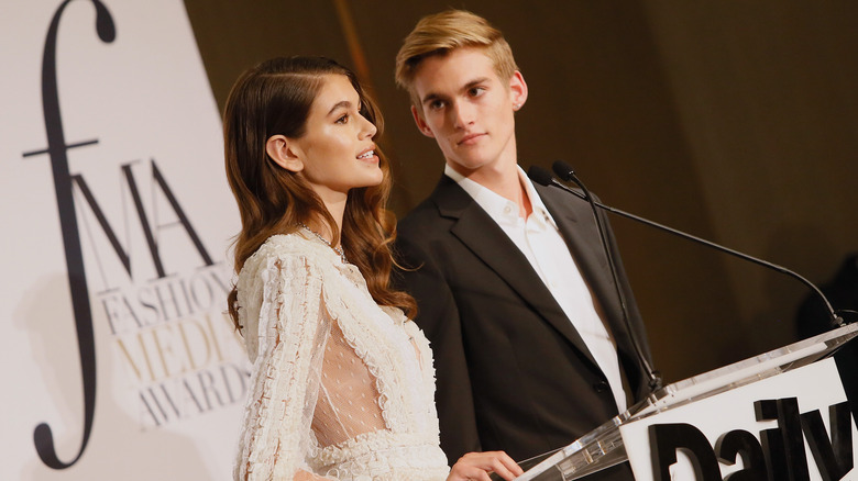 Kaia Gerber and Presley Gerber presenting at an awards show