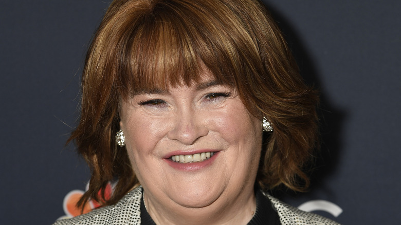Susan Boyle smiling while posing at an event