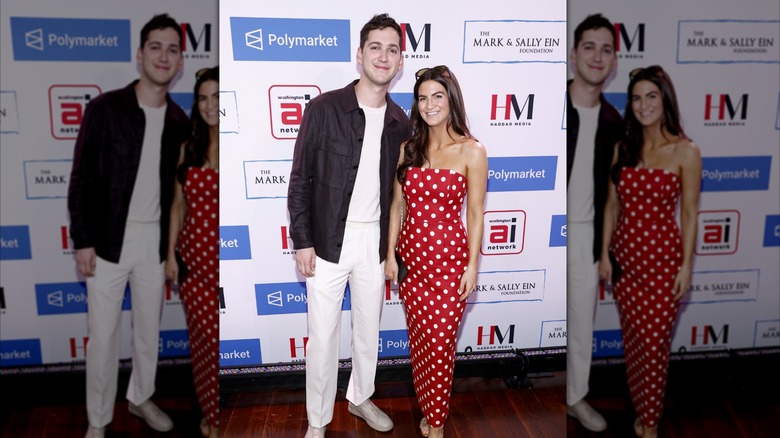 Kaitlan Collins, right, smiling next to a man