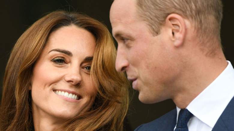 Kate Middleton and Prince William smiling at each other