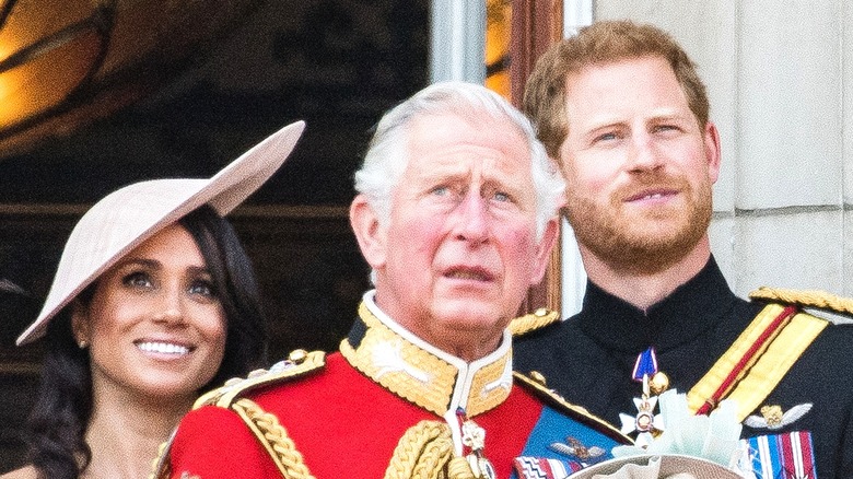 Meghan Markle, Prince Charles, and Prince Harry looking up during Trooping the Colour 2018